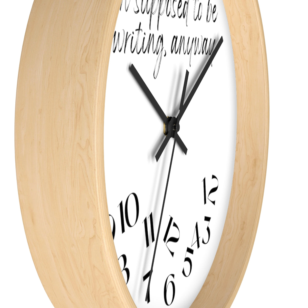 A "I'm Supposed to Be Writing // Writing Themed" wall clock with a quote on it.