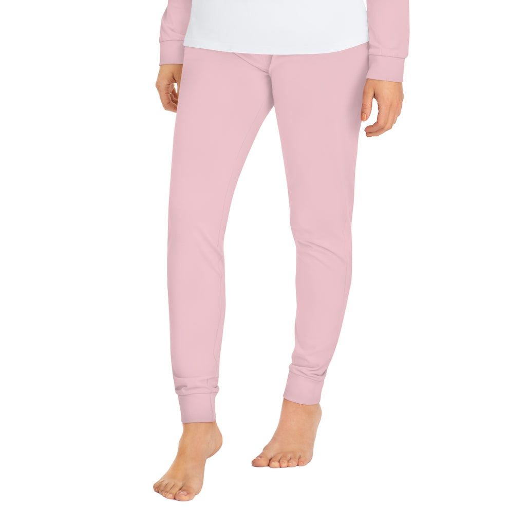 Woman standing in light pink leggings against a white background, embodying the essence of I may look like I'm listening to you, but... Writing Themed Women's Pajama Set.